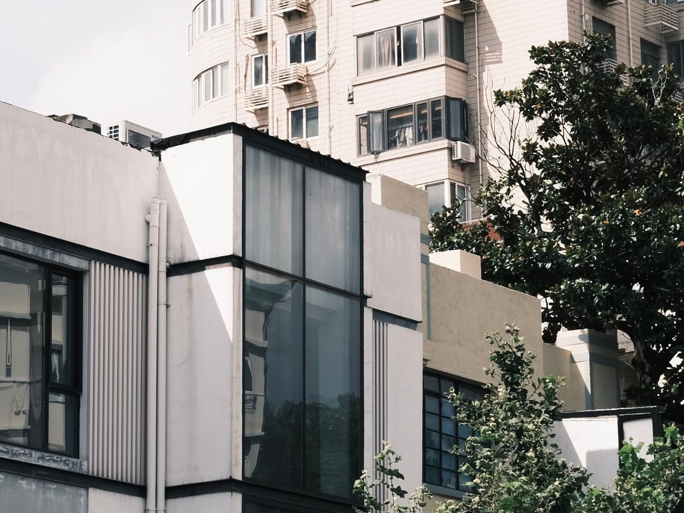 Contemporary apartment building with balconies and large windows