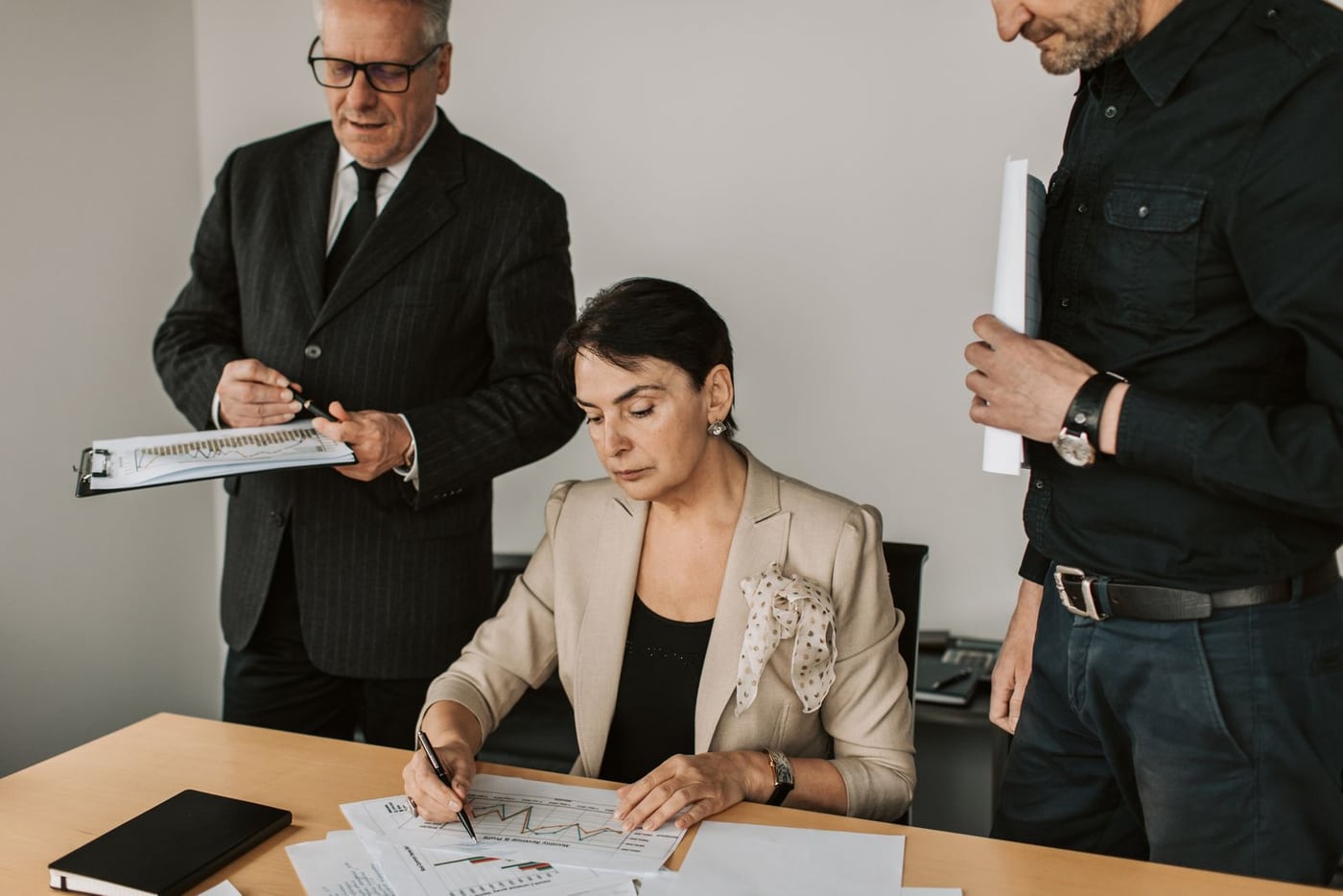 Business partners reviewing documents in an office meeting