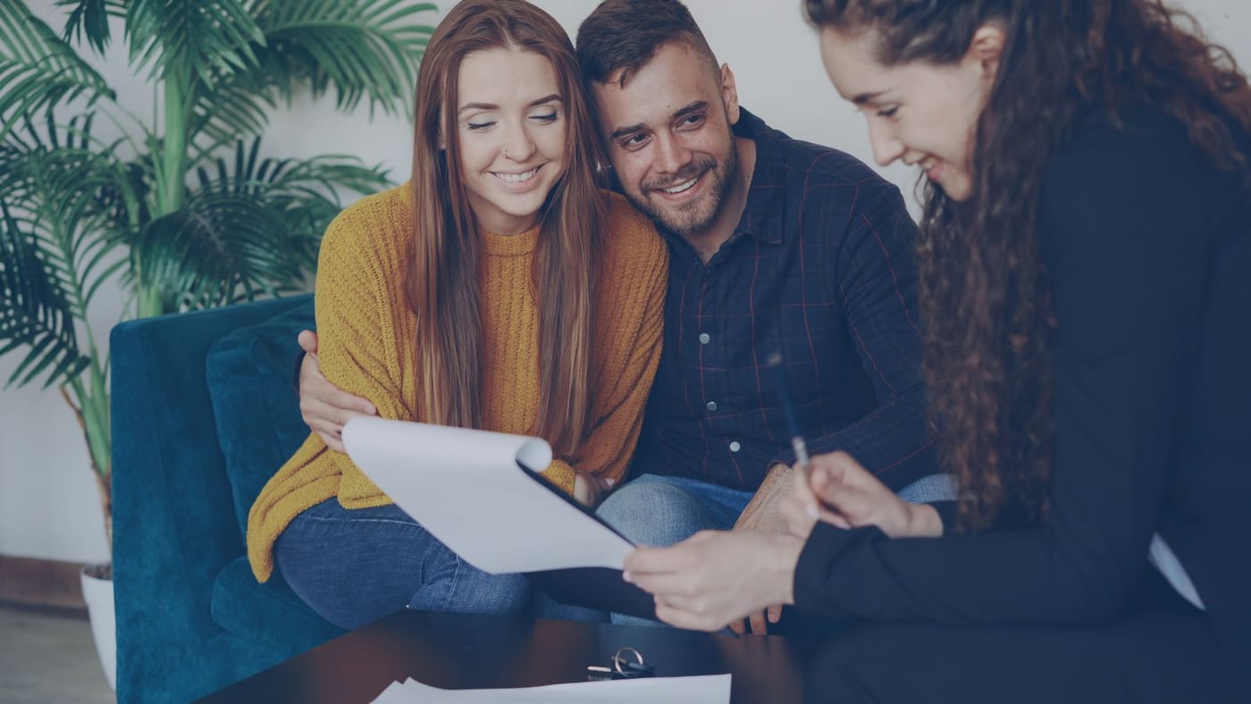 Couple discussing their financing options with an adviser