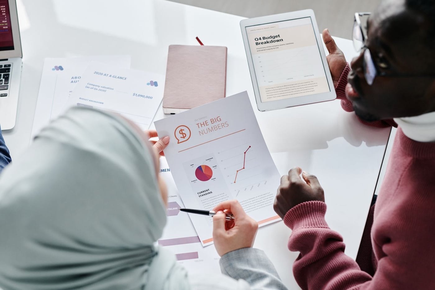 Two people reviewing financial documents together