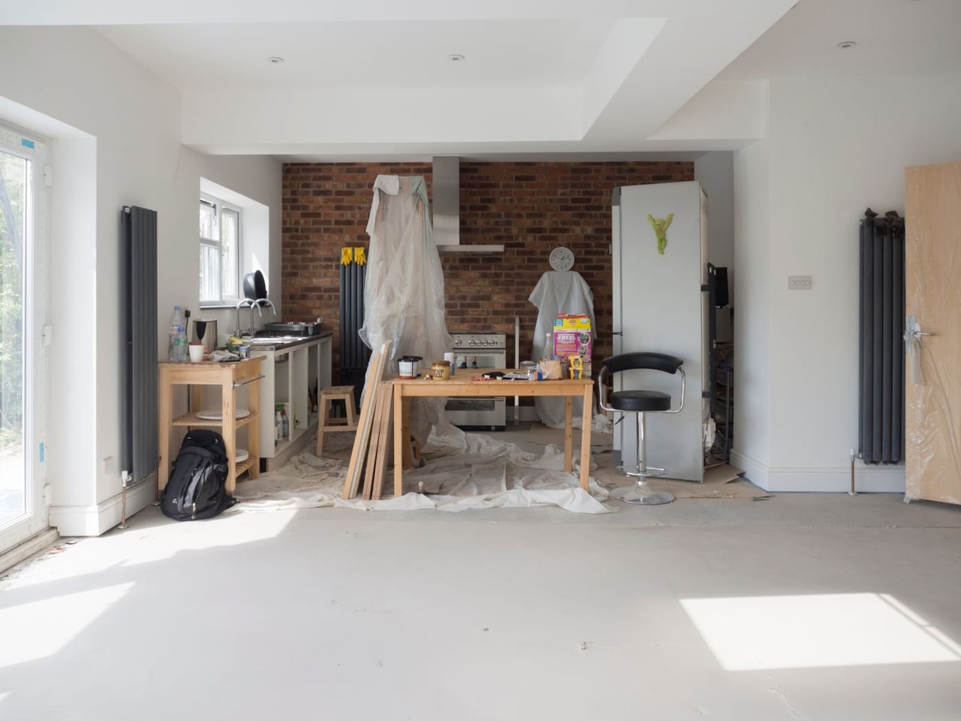 Kitchen extension under renovation with tools and building materials