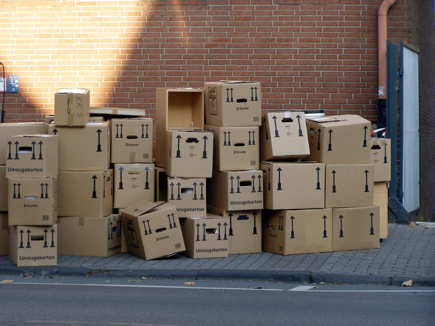 Moving boxes packed and stacked ready for moving day