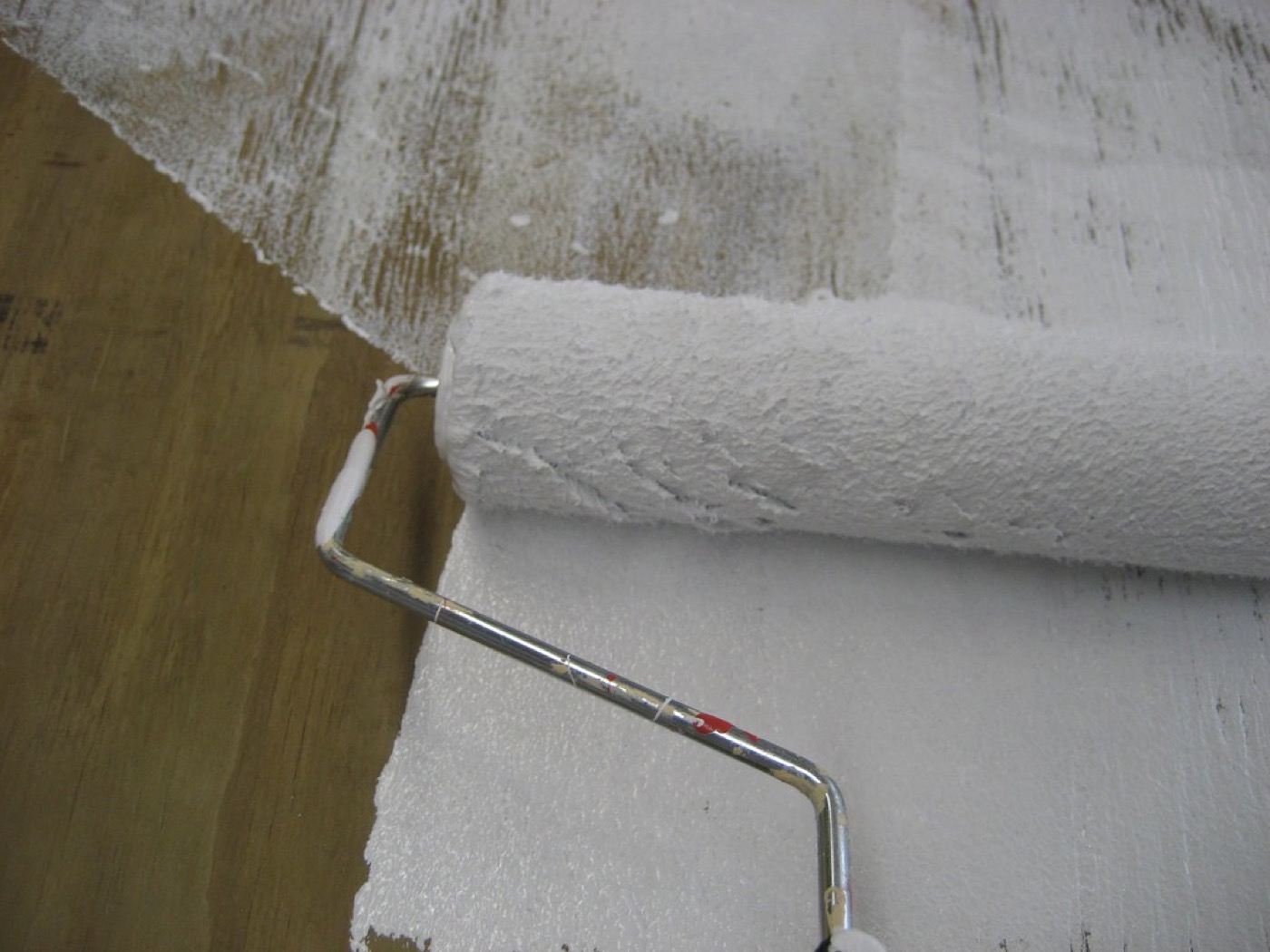 Priming plywood part-way through a renovation